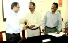 In appreciation of the lecture Chairman Mr. Roby presenting a memento to Dr. Mohandas. Beside him is the Hon Treasurer Mr. Sekaran