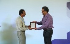 Chairman IIMM receiving a memento in the Healthcare Conference after his paper presentation